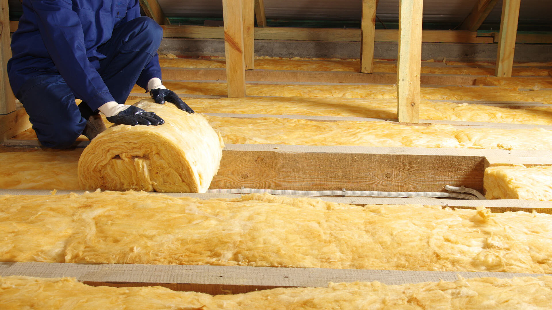 A man is exploring grants and programs for energy efficiency in revitalizing home insulation.