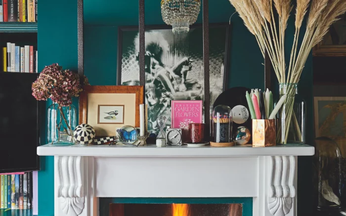 A mantel decorated with family heirlooms and knick knacks to create a unique look