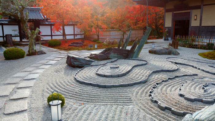A Japanese garden with a tranquil aesthetic, adorned with rocks and stones.