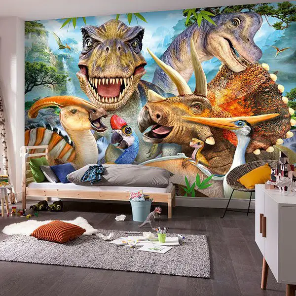 A children's bedroom with dinosaur wall decals.
