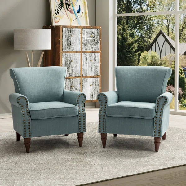 Two blue upholstered living room accent chairs.