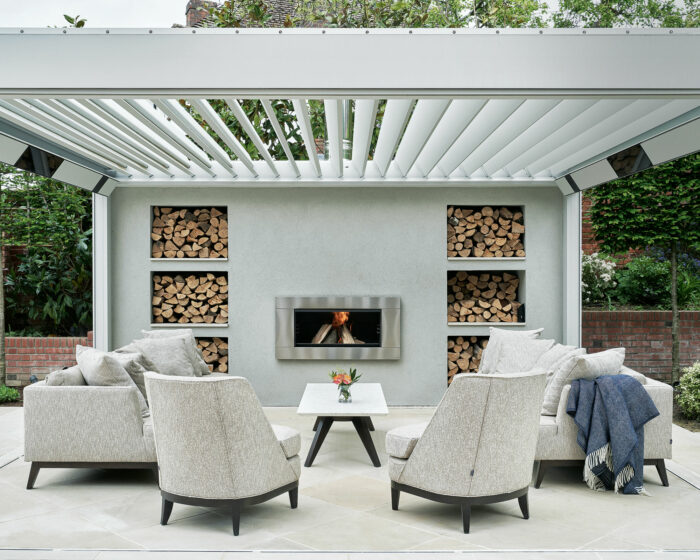 An outdoor living area with a fireplace and fire pit designed for everyone.