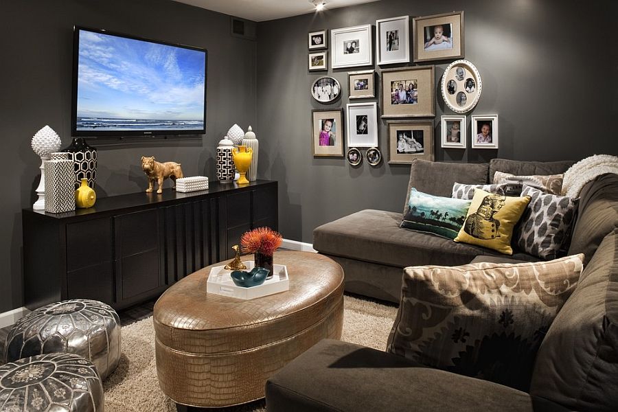 A small living room with a tv and pictures on the wall.