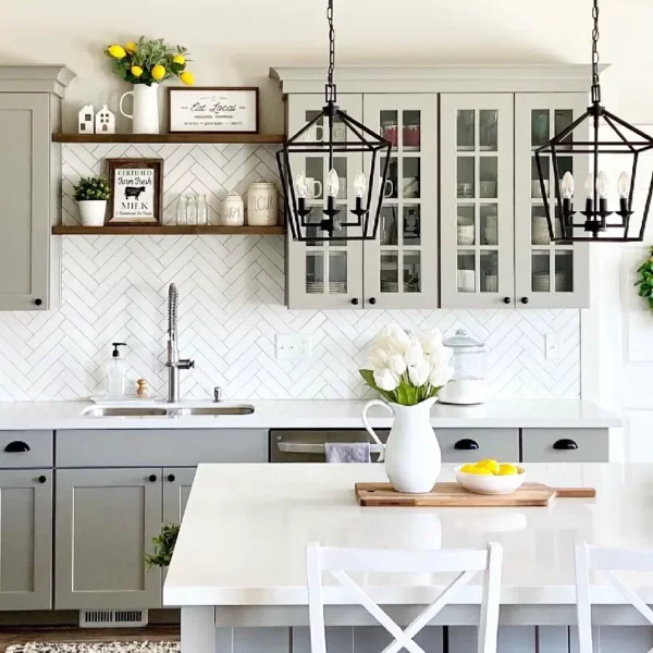 A light gray kitchen with white counter tops.
