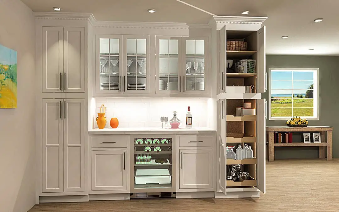 A kitchen with white cabinets and a wine cellar.