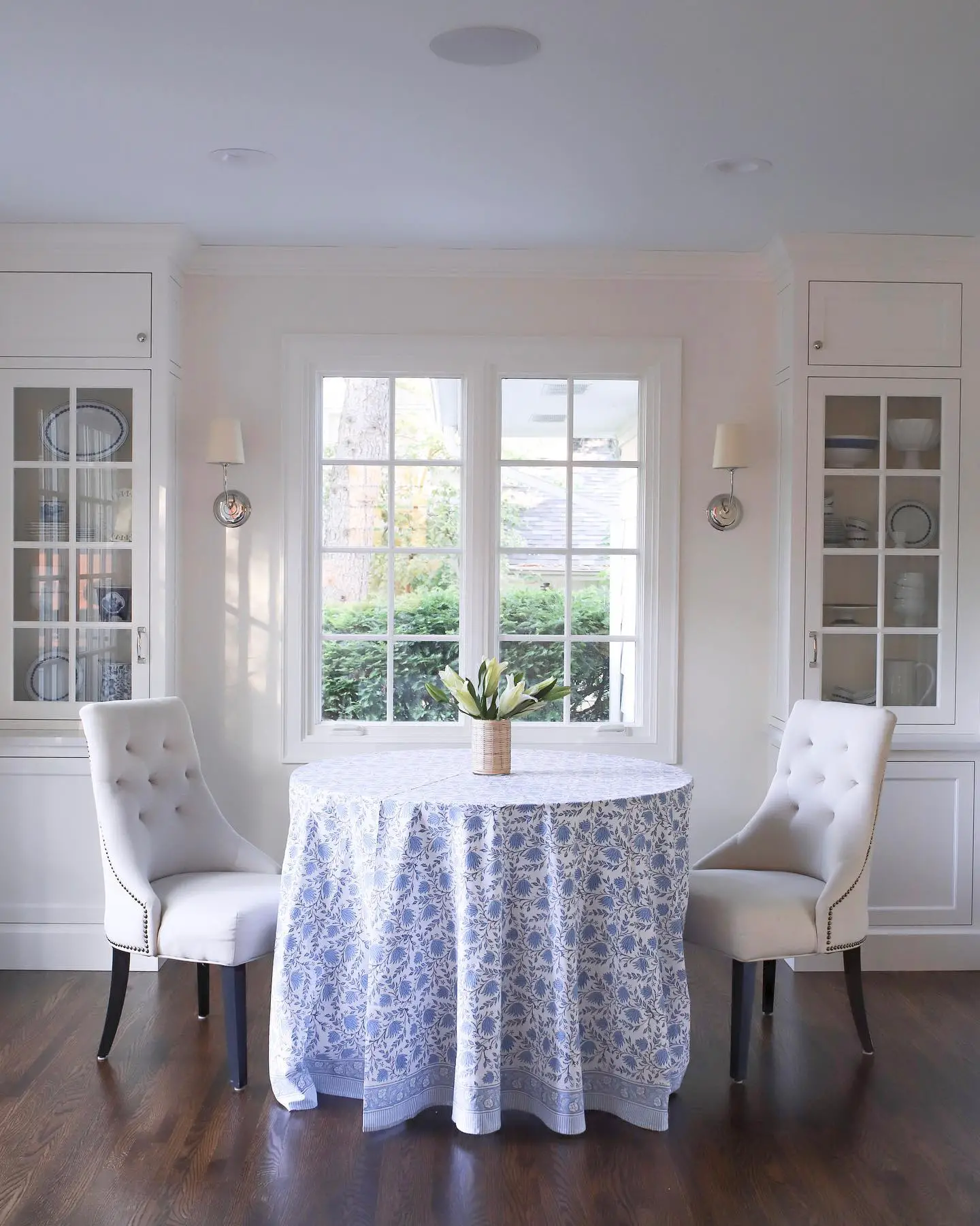 A dining room with a blue and white table and chairs featuring Auto Draft.