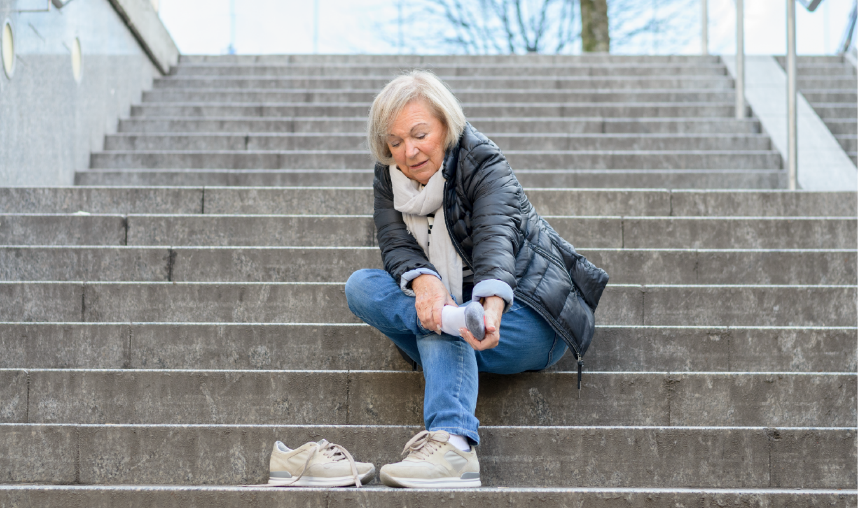 A woman sitting on the steps.