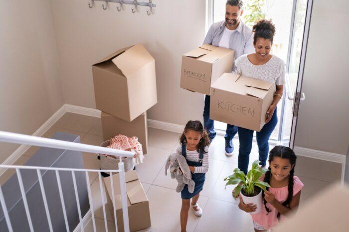 A family is moving into a new home for local moving.