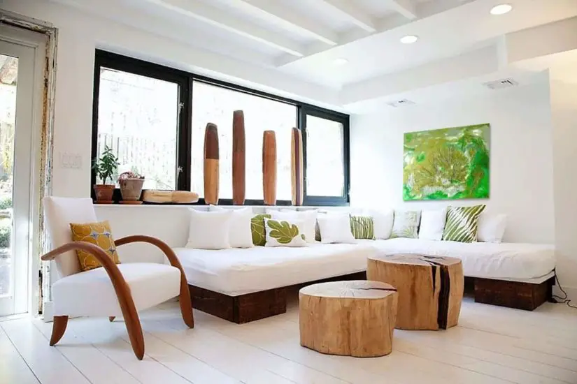 A white living room with wooden furniture.