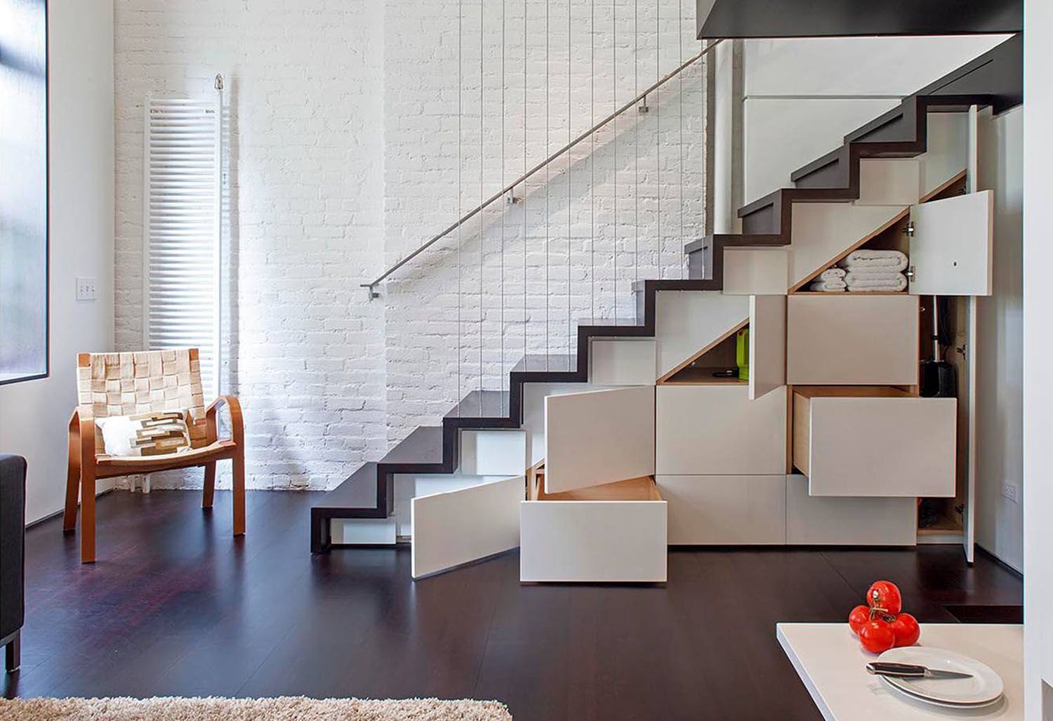 Modern staircase with storage in stylish interior.