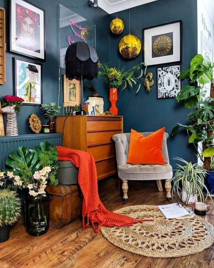 Eclectic bohemian room decor with plants and vintage furniture.