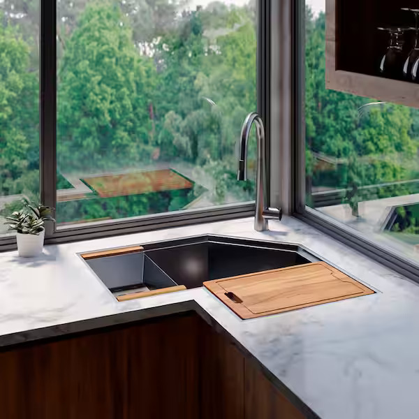 Modern kitchen sink with greenery view from window.