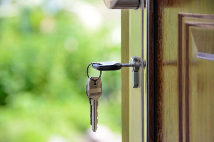 Keys in door lock, home security concept