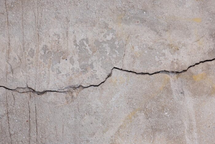 Close-up of a horizontal crack in a concrete foundation wall
