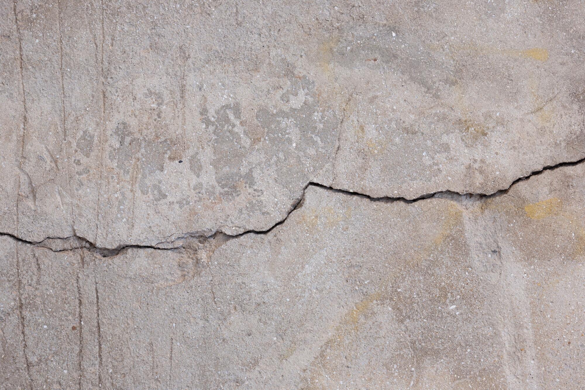 Close-up of a horizontal crack in a concrete foundation wall